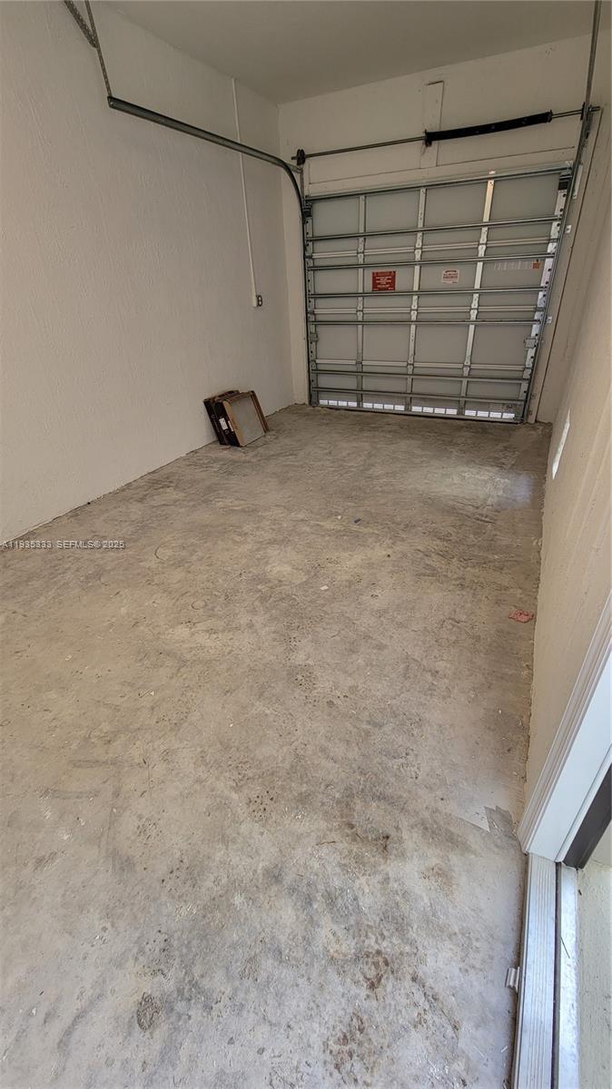 26430 Southwest 148th Court, Unit 26430 Homestead, FL 33032 - Photo 19 of 21 a view of an empty room