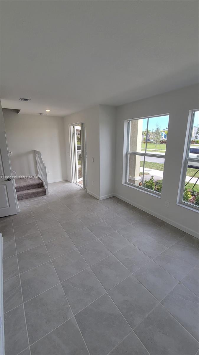 26430 Southwest 148th Court, Unit 26430 Homestead, FL 33032 - Photo 4 of 21 a view of an empty room with a window