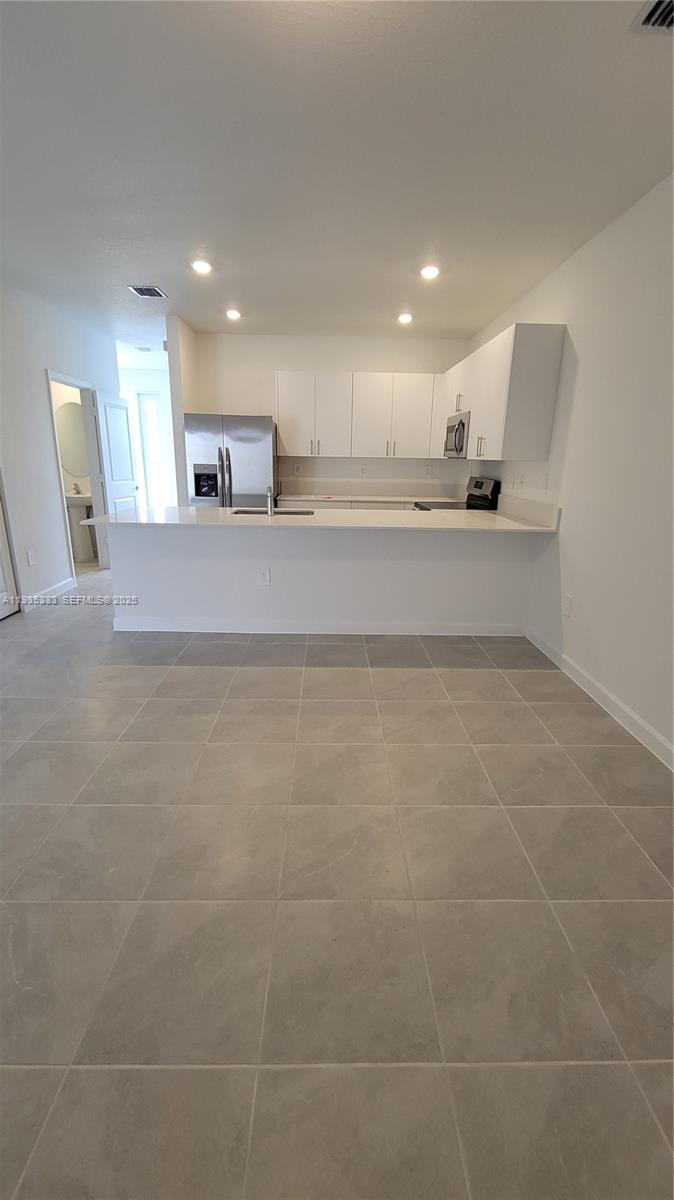 26430 Southwest 148th Court, Unit 26430 Homestead, FL 33032 - Photo 6 of 21 a view of a livingroom with a furniture