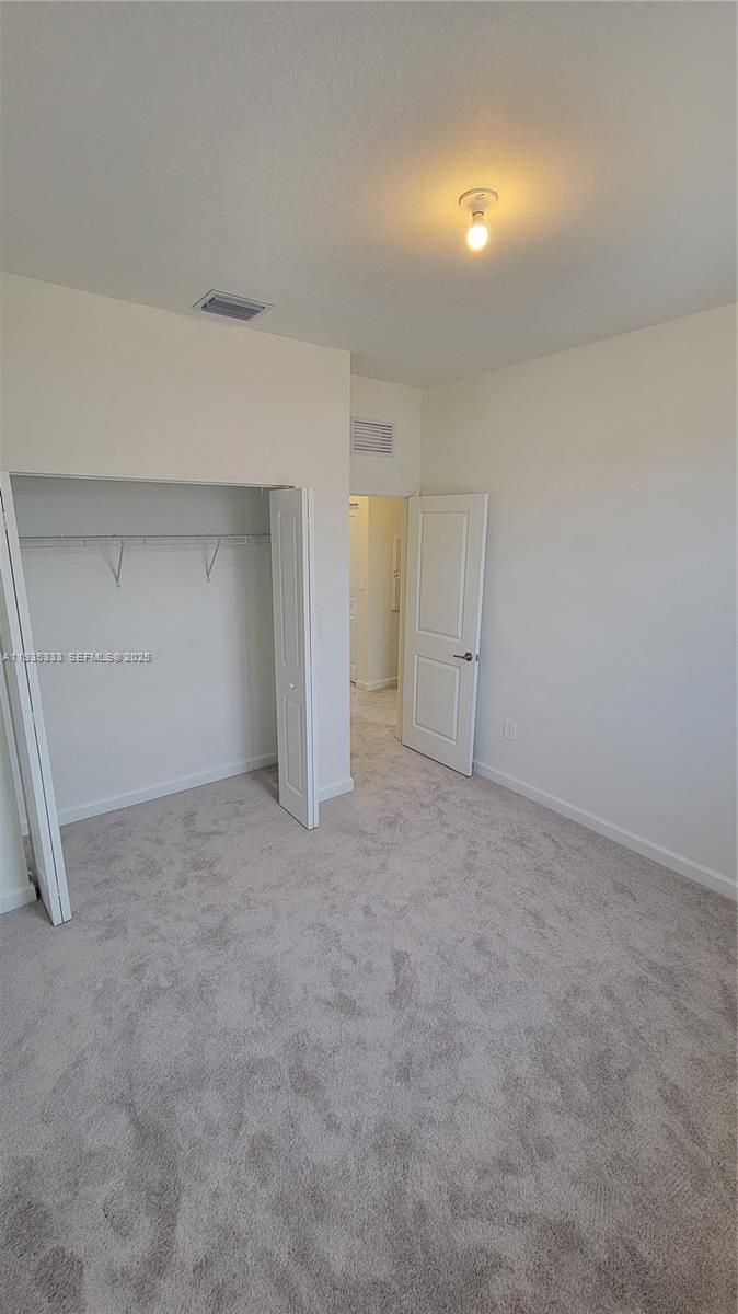 26430 Southwest 148th Court, Unit 26430 Homestead, FL 33032 - Photo 10 of 21 a view of an empty room