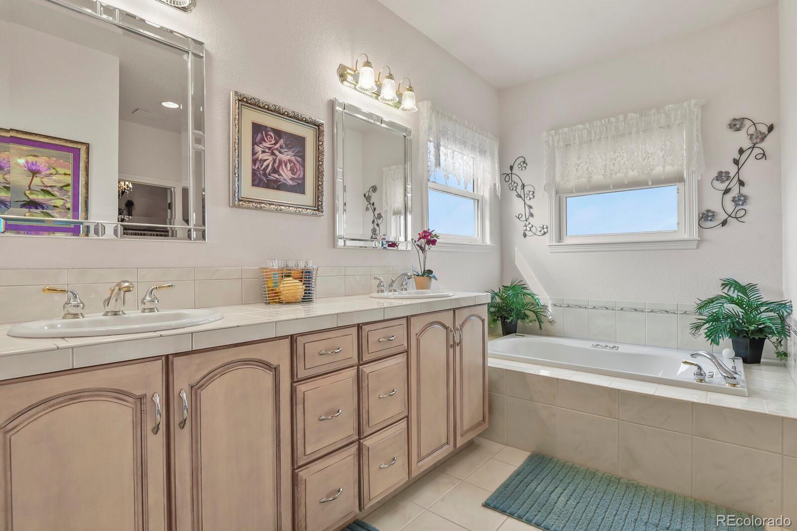 26846 Richards Circle Elbert, CO 80106 - Photo 12 of 49 a spacious bathroom with a tub sink and mirror