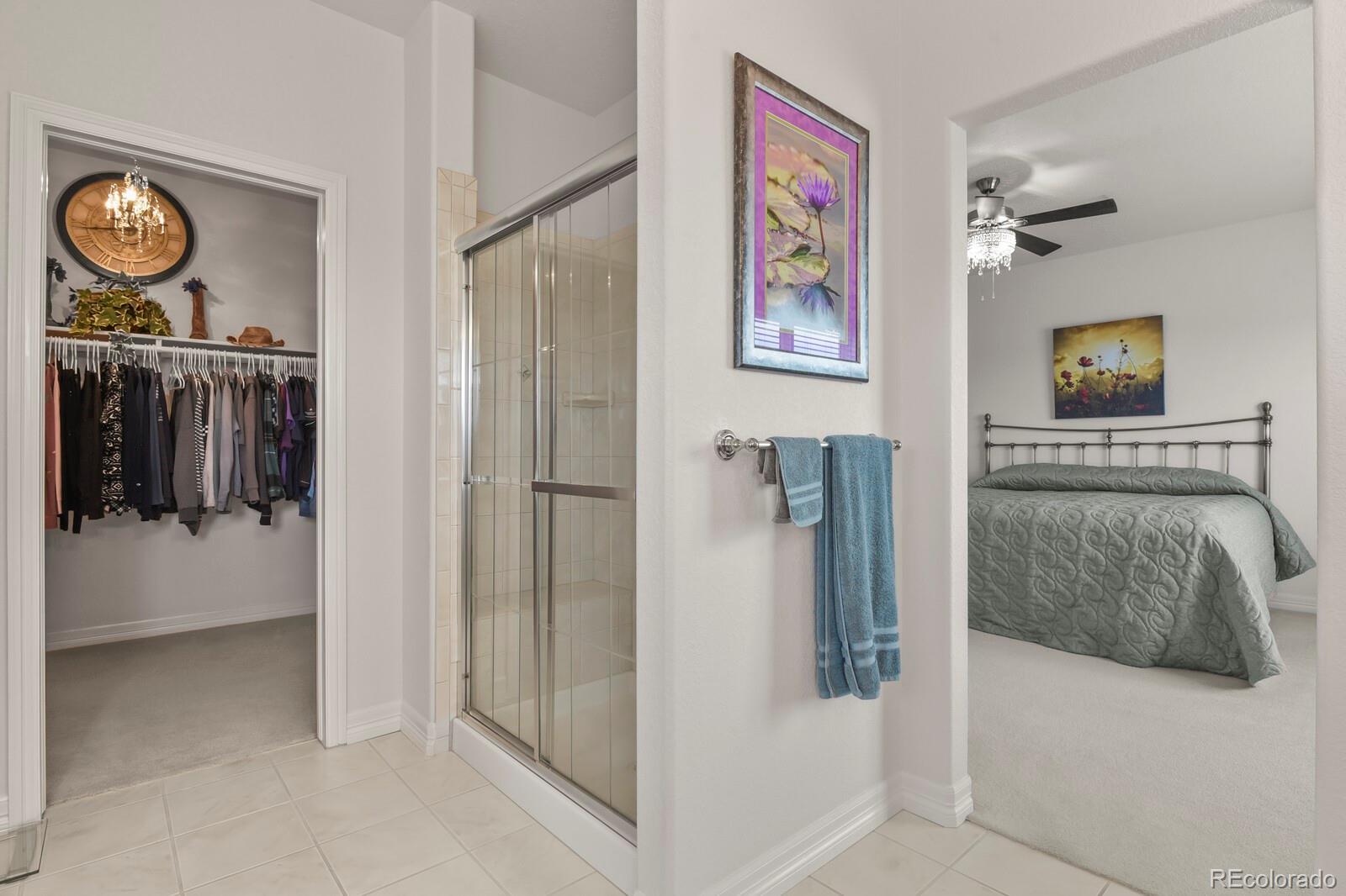 26846 Richards Circle Elbert, CO 80106 - Photo 13 of 49 a view of a hallway with paintings on the wall