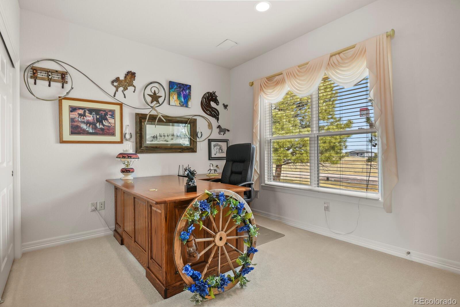 26846 Richards Circle Elbert, CO 80106 - Photo 14 of 49 a view of a bedroom with baby bed and a window