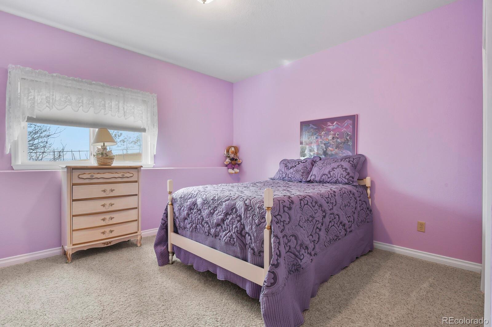 26846 Richards Circle Elbert, CO 80106 - Photo 19 of 49 a spacious bedroom with a bed and a dresser