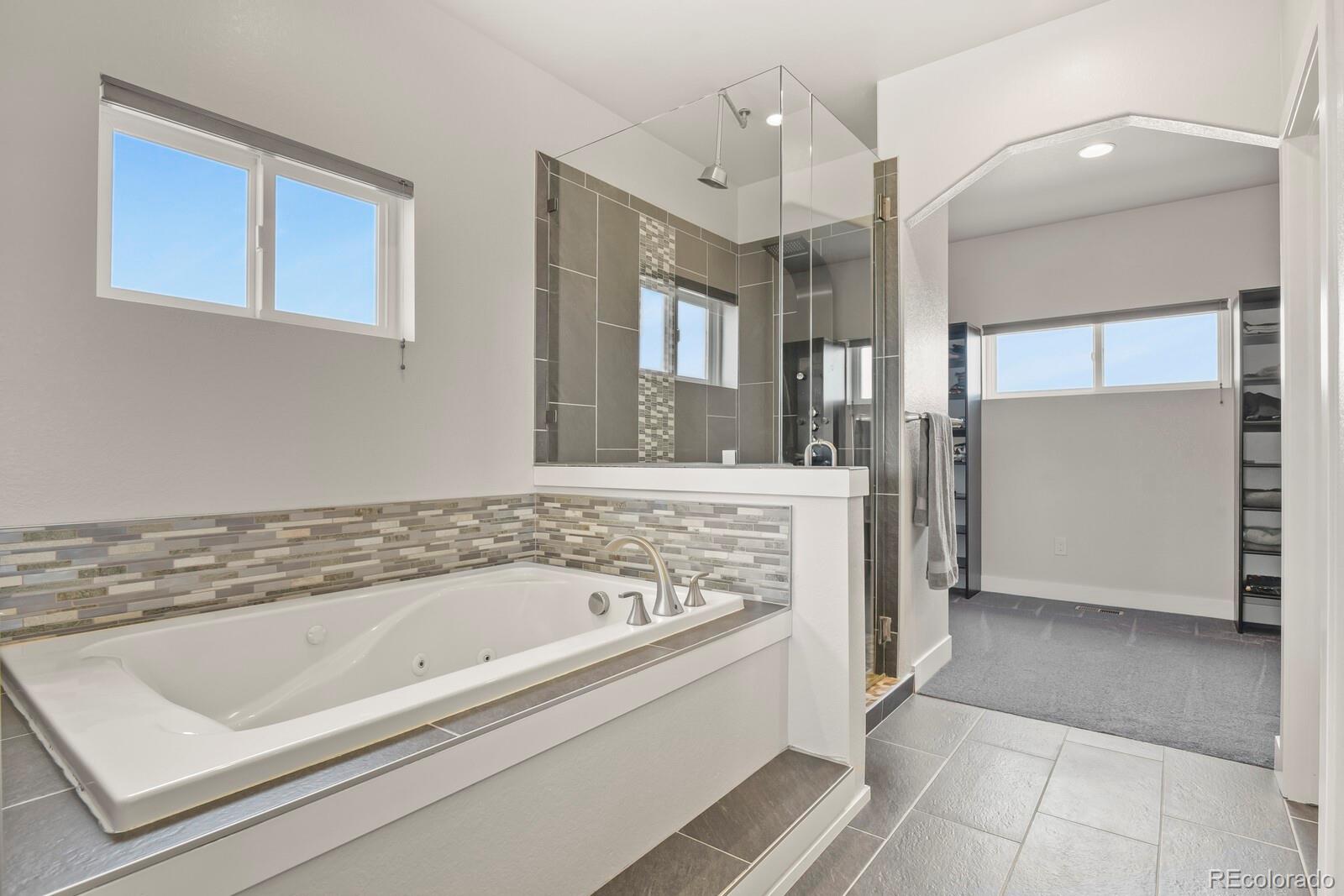 26846 Richards Circle Elbert, CO 80106 - Photo 31 of 49 a spacious bathroom with a bathtub and a sink