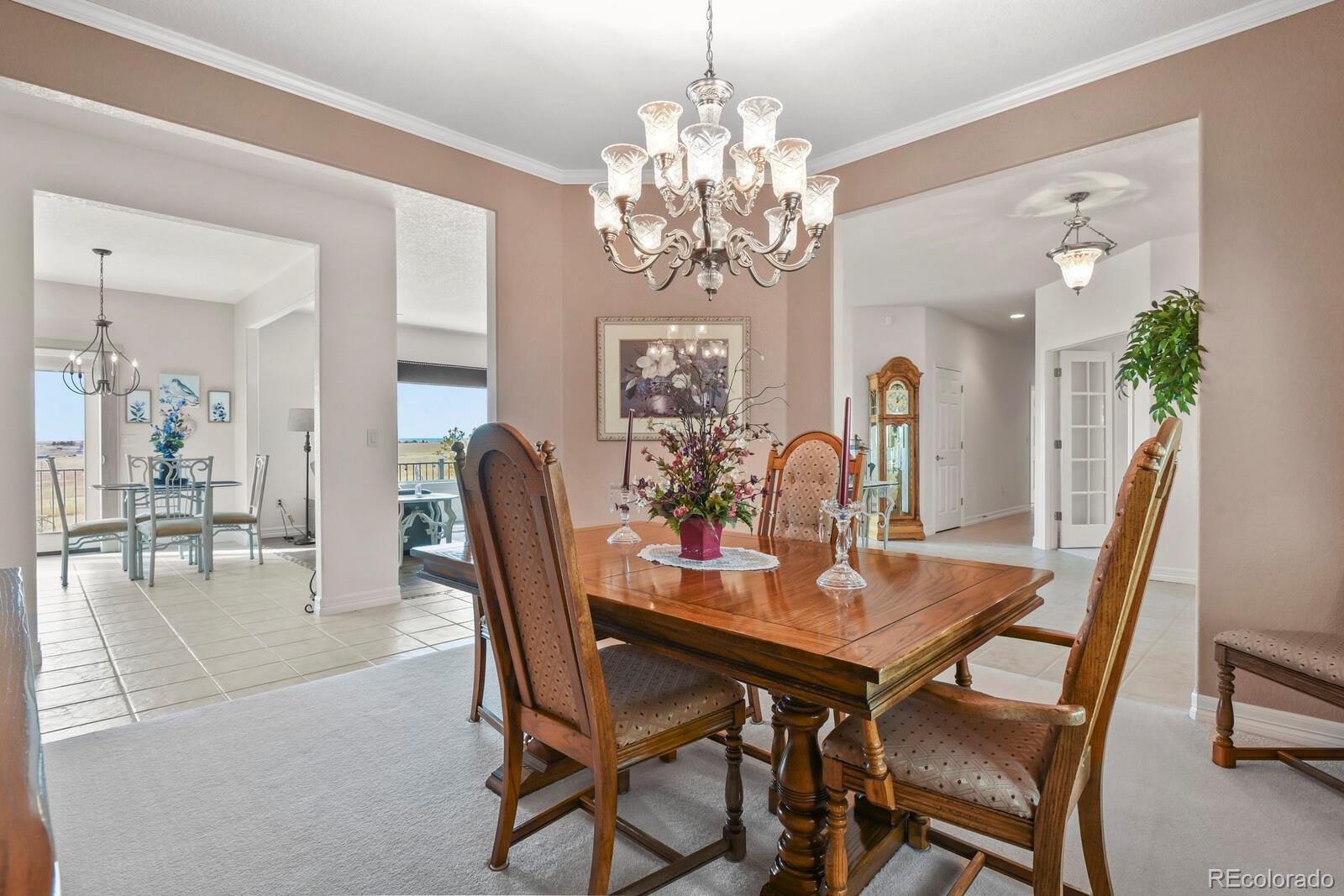 26846 Richards Circle Elbert, CO 80106 - Photo 7 of 49 a view of a dining room with furniture and chandelier