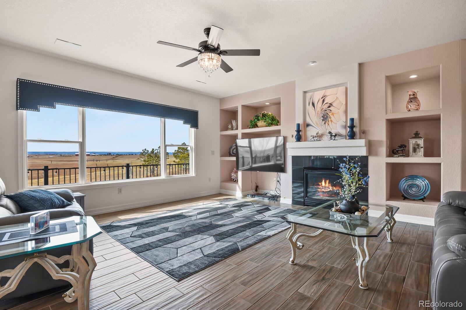 26846 Richards Circle Elbert, CO 80106 - Photo 9 of 49 a living room with furniture and a fireplace