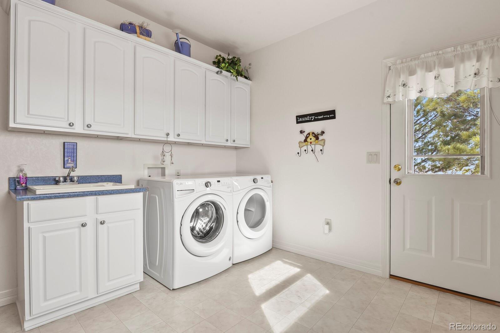 26846 Richards Circle Elbert, CO 80106 - Photo 10 of 49 a utility room with dryer and washer