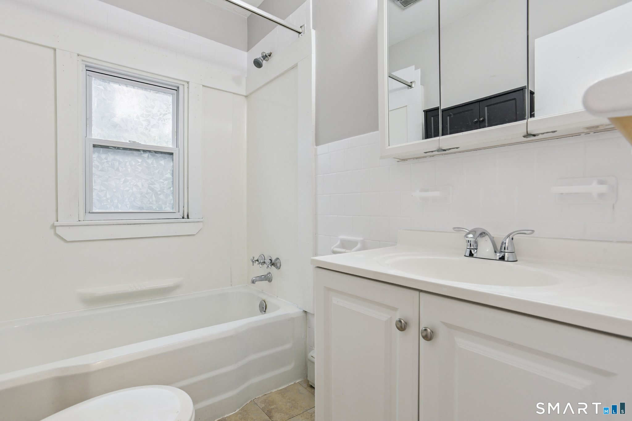 41 Fountain Street Norwich, CT 06360 - Photo 14 of 30 a bathroom with a sink a toilet and bathtub