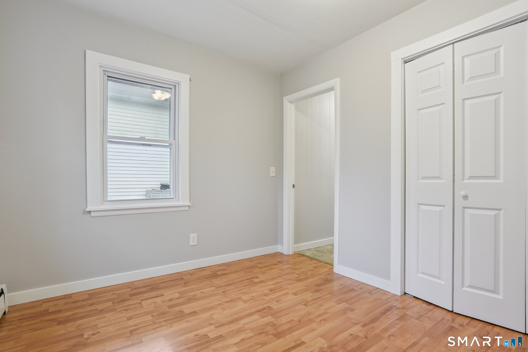 41 Fountain Street Norwich, CT 06360 - Photo 17 of 30 a view of an empty room with wooden floor