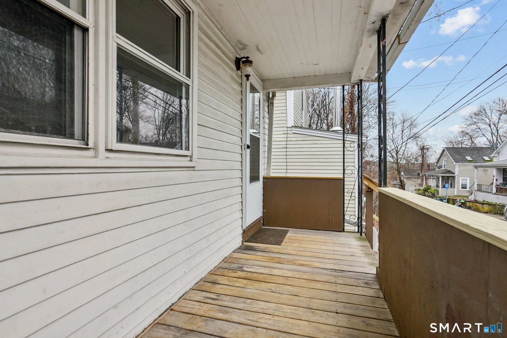 41 Fountain Street Norwich, CT 06360 - Photo 3 of 30 a view of a balcony with wooden floor