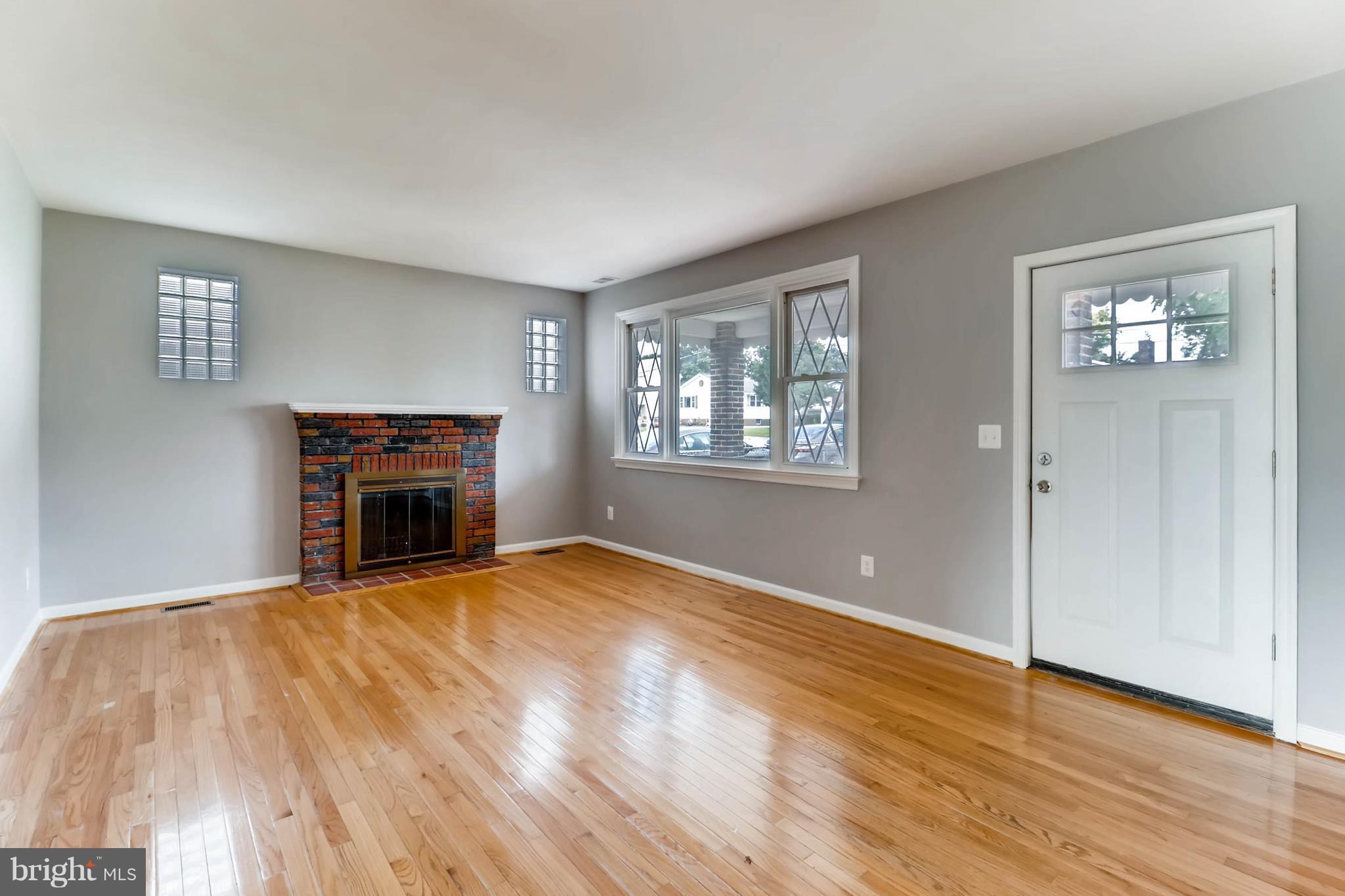 355 Upperlanding Road Baltimore, MD 21221 - Photo 3 of 17 LR w/ refinished HW floors and wood burning f/p!