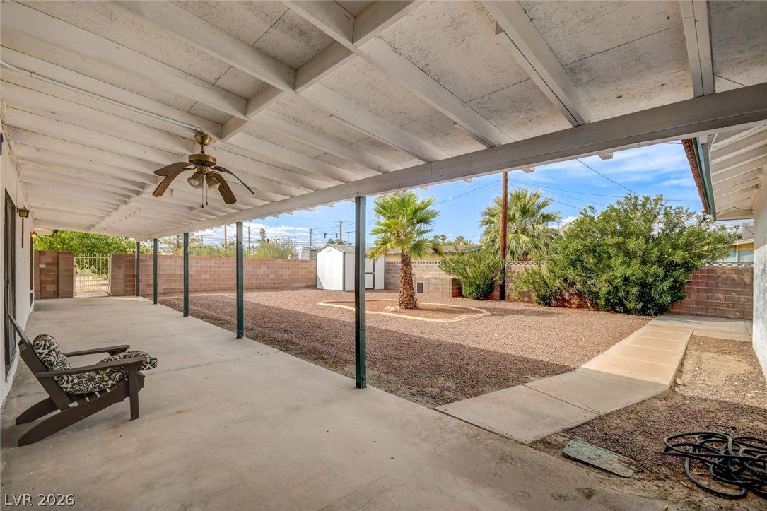 1401 Sharon Road Las Vegas, NV 89106 - Photo 63 of 73 A deep covered patio overlooks the low-maintenance gravel backyard enclosed by privacy fencing.