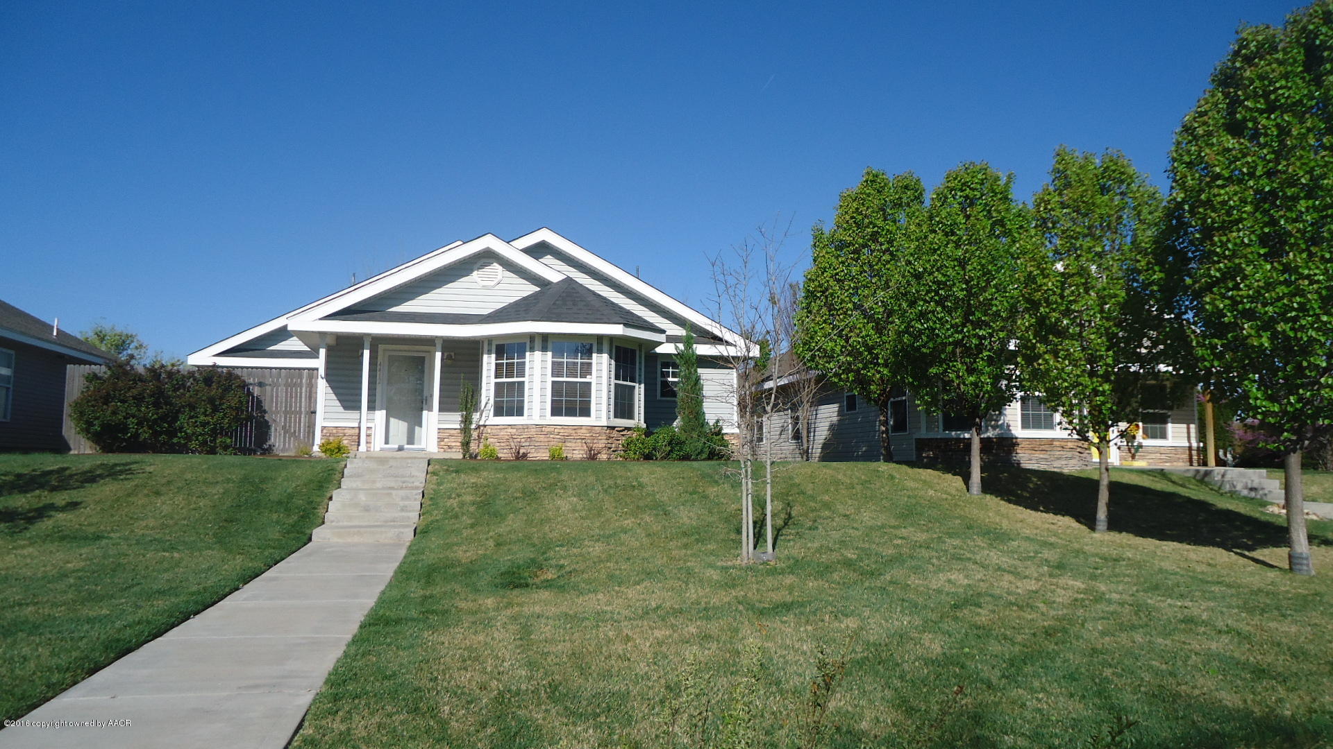 4412 South Austin Street Amarillo, TX 79110 - Photo 1 of 10 a front view of a house with a yard