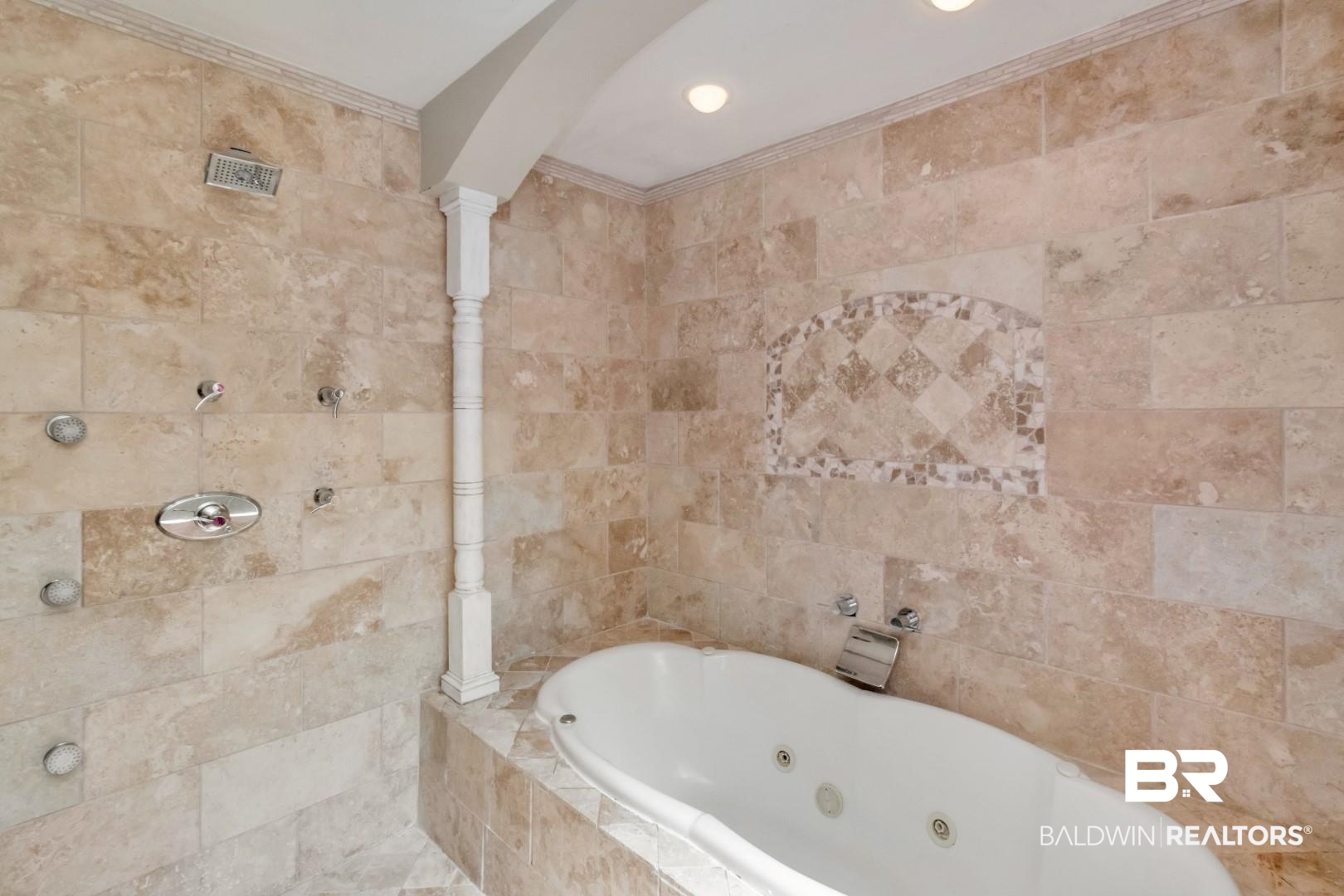 116 Florence Place Mobile, AL 36607 - Photo 25 of 41 Bathroom featuring tiled bath, crown molding, and tile walls