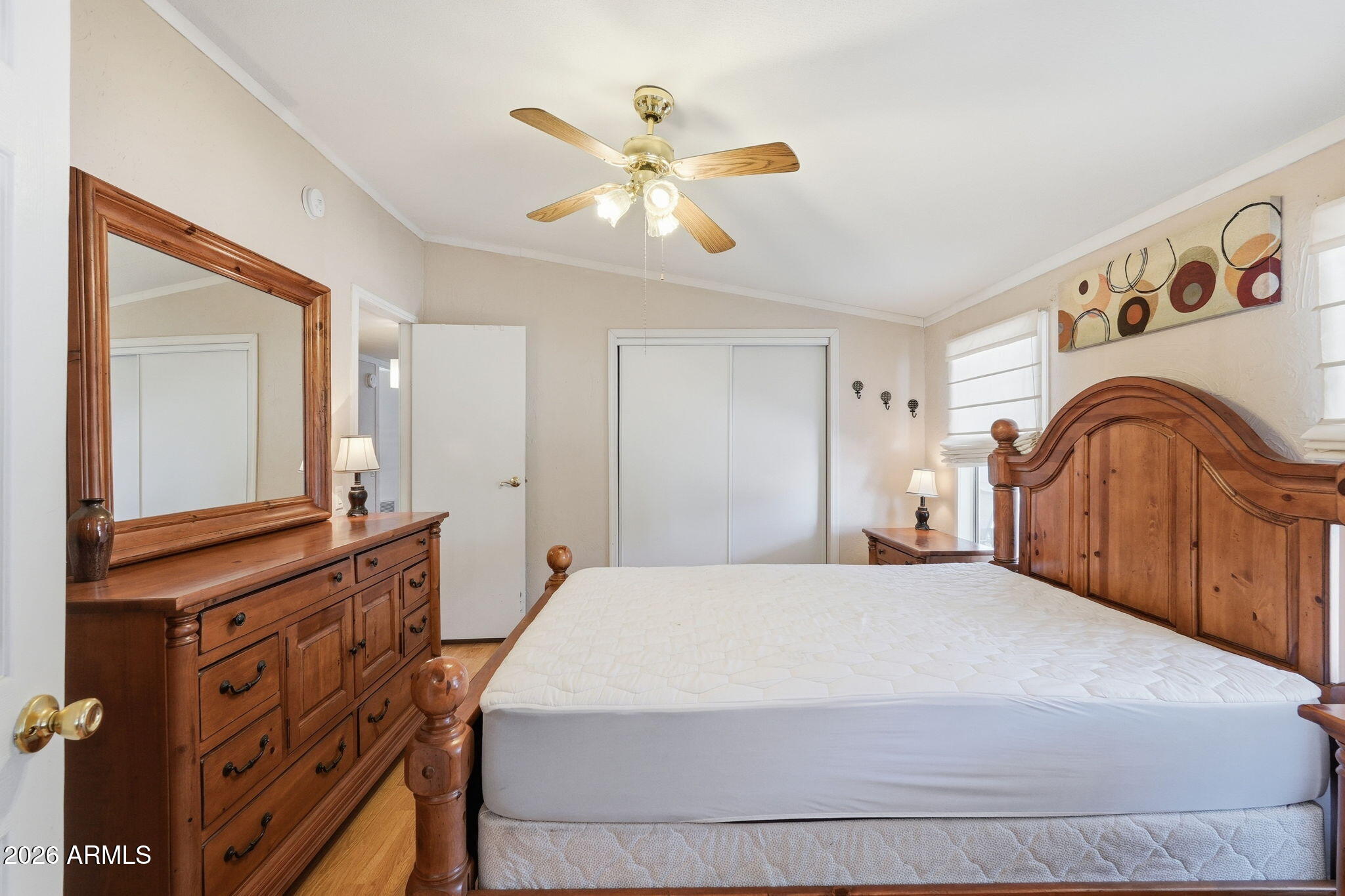 53 North Mountain Road, Unit 38 Apache Junction, AZ 85120 - Photo 21 of 35 a bedroom with a bed and a chandelier
