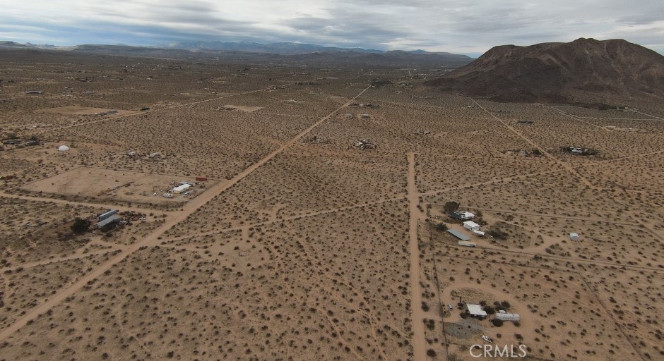 60396 Lorraine Road Landers, CA 92285 - Photo 8 of 15 a view of a dry yard with wooden floor