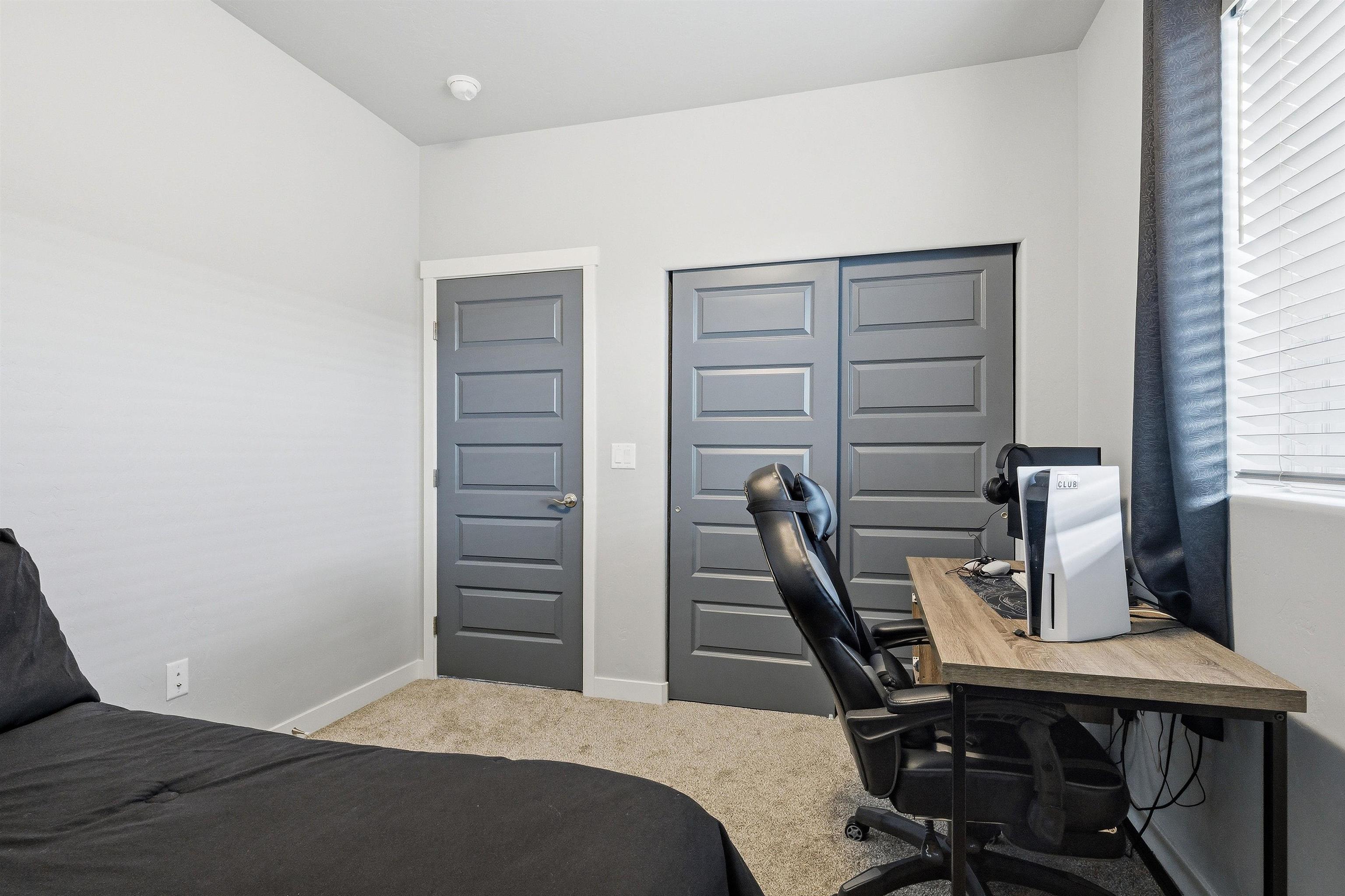 2459 Hamilton Road, Unit A Grand Junction, CO 81505 - Photo 25 of 27 a bedroom with a bed and furniture