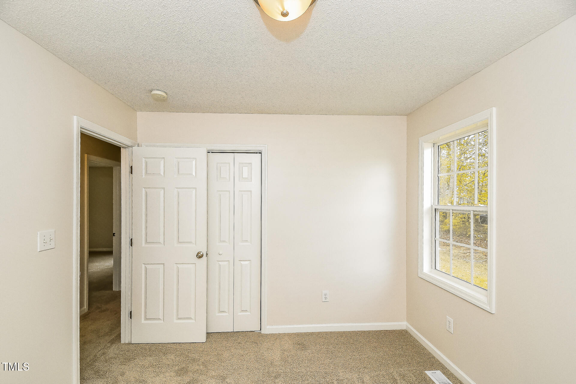 1003 Walnut Drive Erwin, NC 28339 - Photo 11 of 16 an empty room with windows
