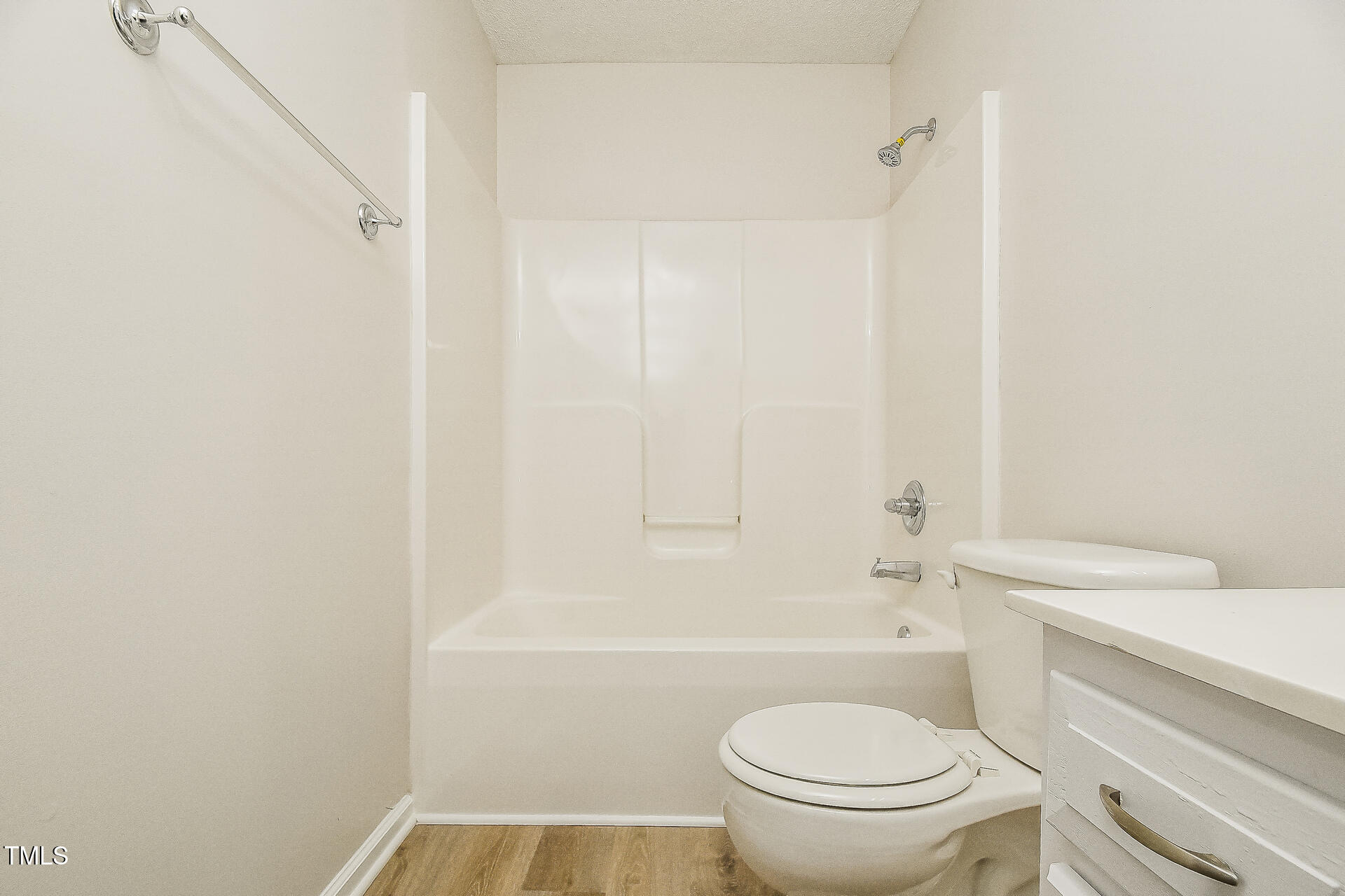 1003 Walnut Drive Erwin, NC 28339 - Photo 13 of 16 a bathroom with a sink a toilet and shower