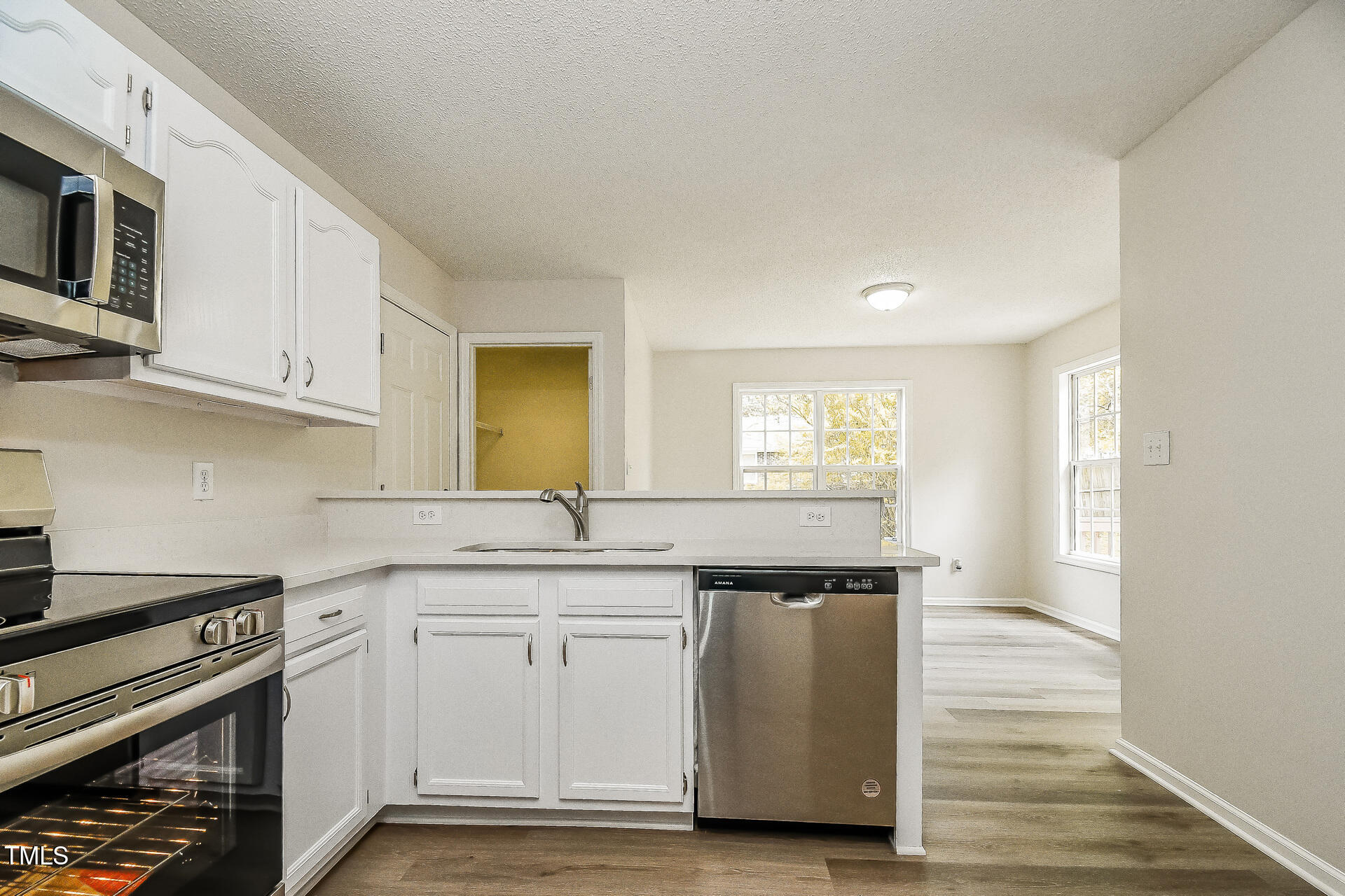 1003 Walnut Drive Erwin, NC 28339 - Photo 4 of 16 a kitchen with stainless steel appliances granite countertop a sink and a stove