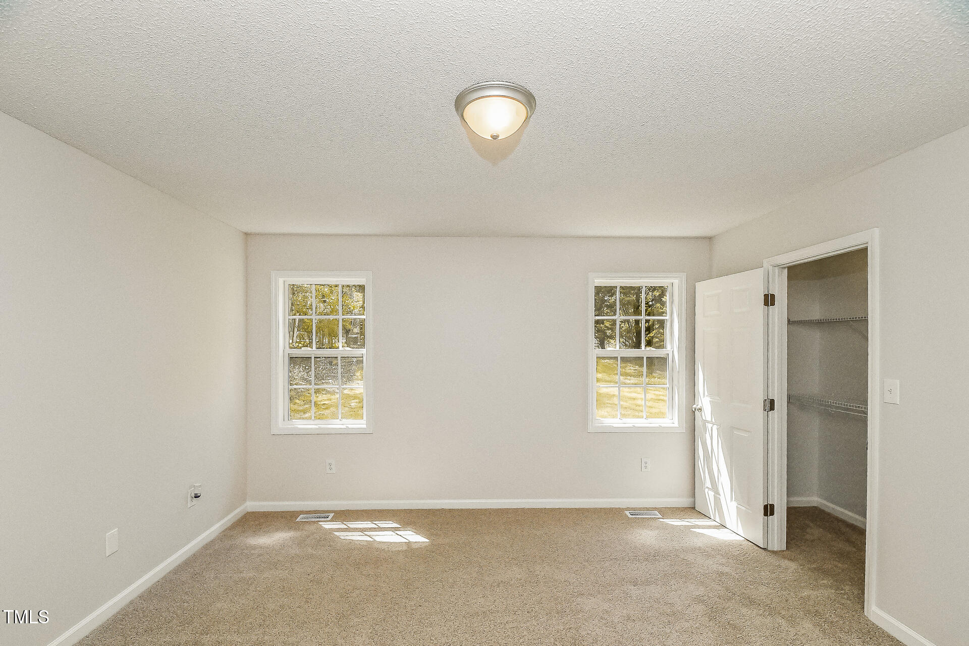 1003 Walnut Drive Erwin, NC 28339 - Photo 6 of 16 an empty room with windows