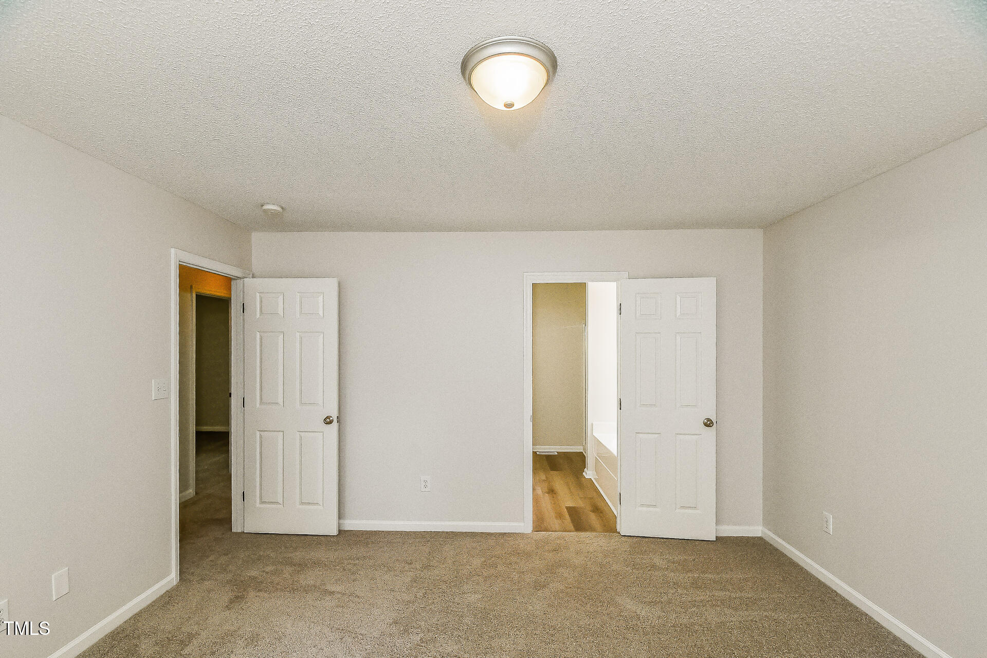 1003 Walnut Drive Erwin, NC 28339 - Photo 7 of 16 an empty room with a door