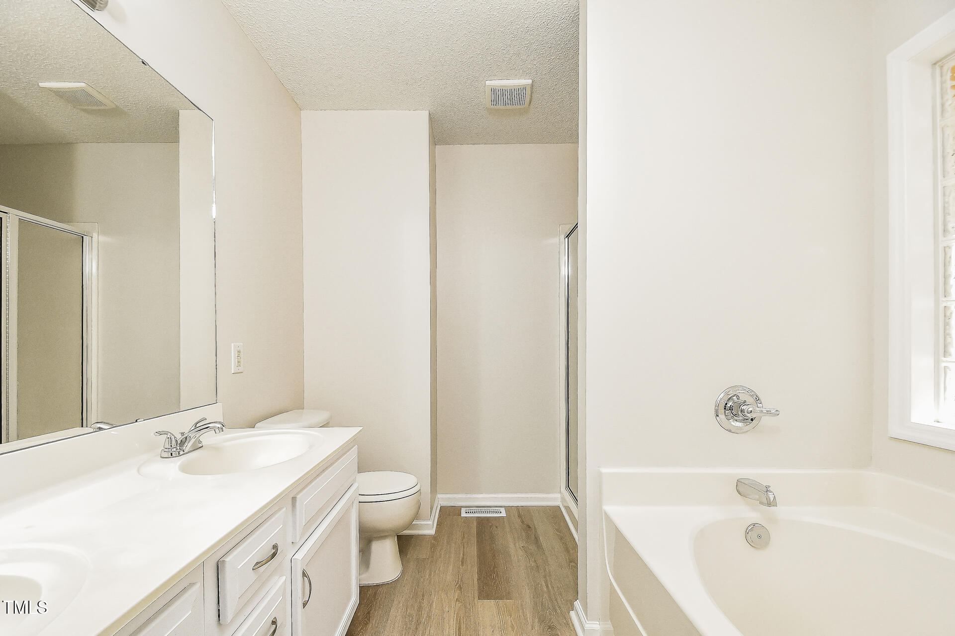 1003 Walnut Drive Erwin, NC 28339 - Photo 8 of 16 a bathroom with a sink a toilet and shower