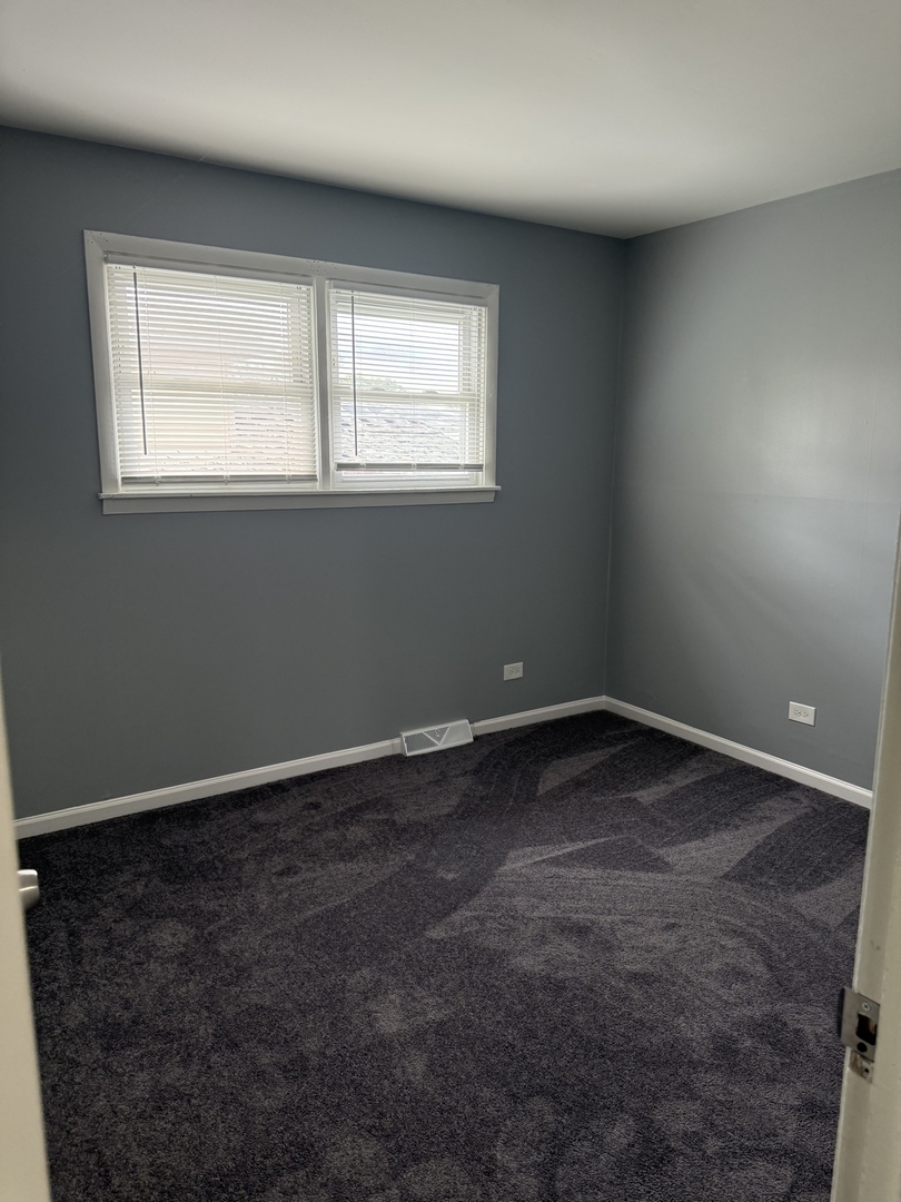 2352 West 157th Place Markham, IL 60426 - Photo 15 of 28 an empty room with a window