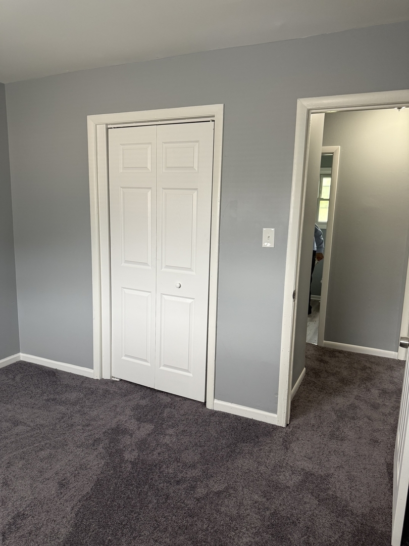 2352 West 157th Place Markham, IL 60426 - Photo 16 of 28 an empty room with closet and a bathroom