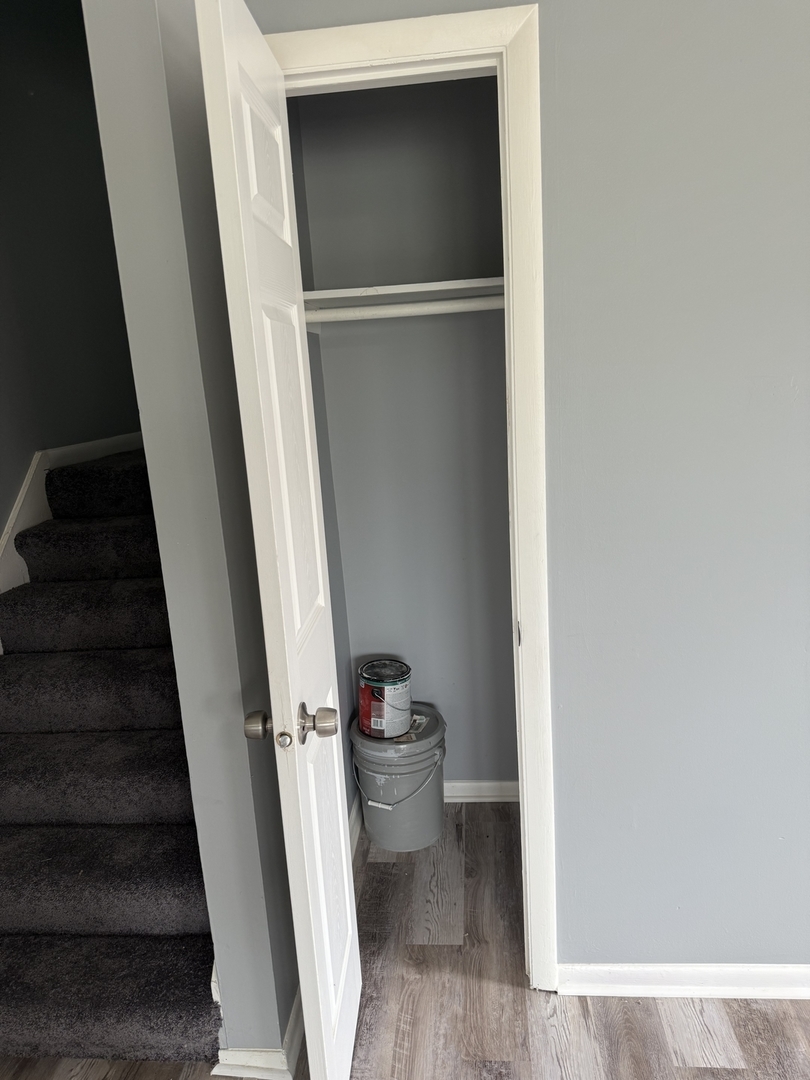 2352 West 157th Place Markham, IL 60426 - Photo 9 of 28 a view of a hallway with wooden floor and a bathroom