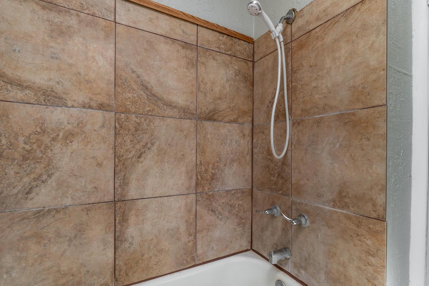 8015 Upton Road Amarillo, TX 79119 - Photo 13 of 16 a bathroom with a shower