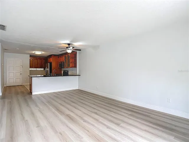 a view of a kitchen with a dishwasher and cabinets
