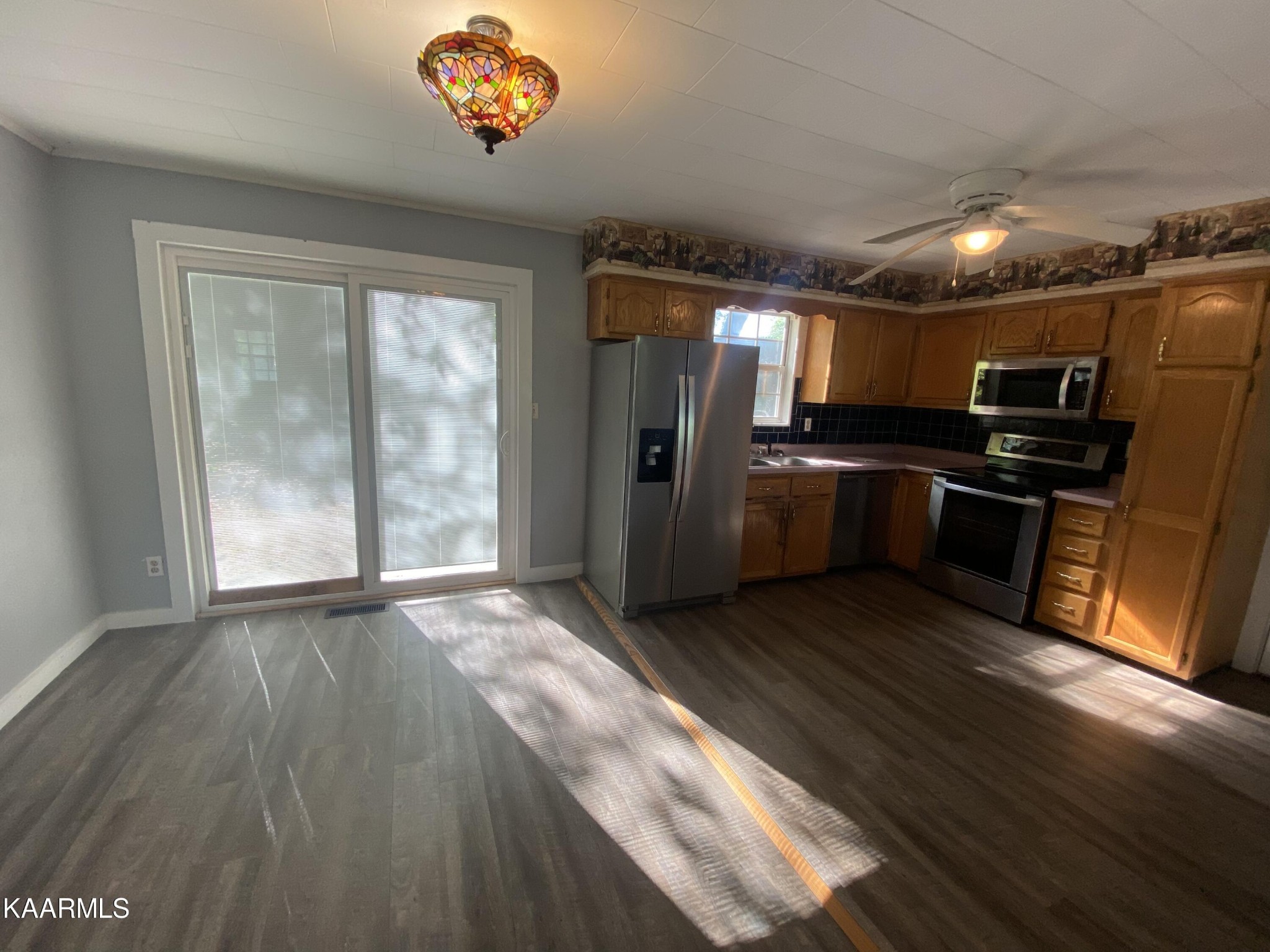 132 Dustin Lane Oneida, TN 37841 - Photo 12 of 27 wooden floor in an empty room with a window