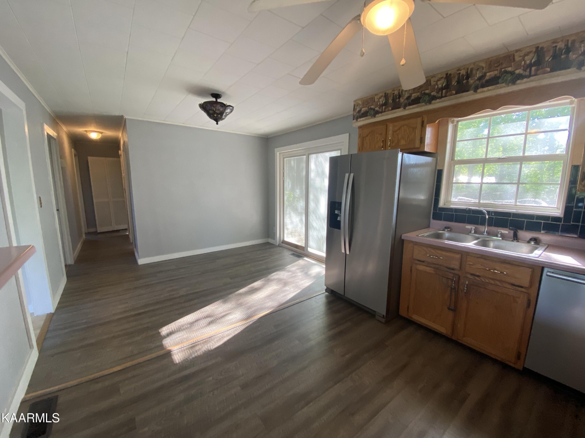 132 Dustin Lane Oneida, TN 37841 - Photo 15 of 27 a kitchen with stainless steel appliances granite countertop a refrigerator and a sink