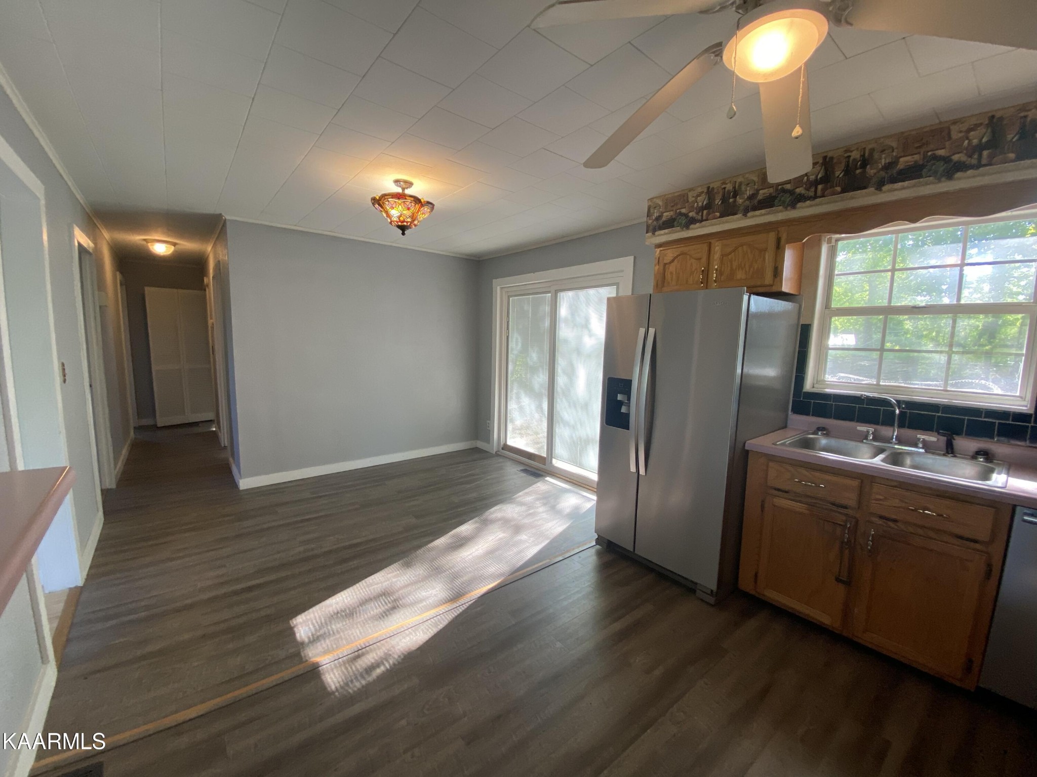 132 Dustin Lane Oneida, TN 37841 - Photo 16 of 27 a kitchen with stainless steel appliances granite countertop a refrigerator a stove and a wooden floors