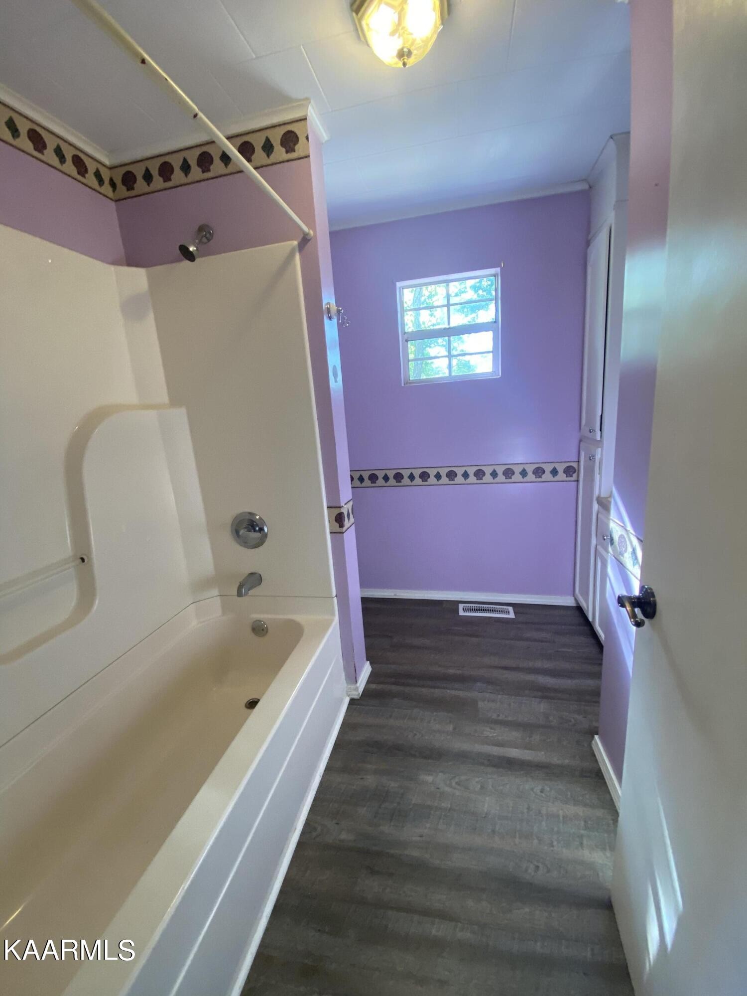 132 Dustin Lane Oneida, TN 37841 - Photo 17 of 27 a bathroom with a bathtub and shower