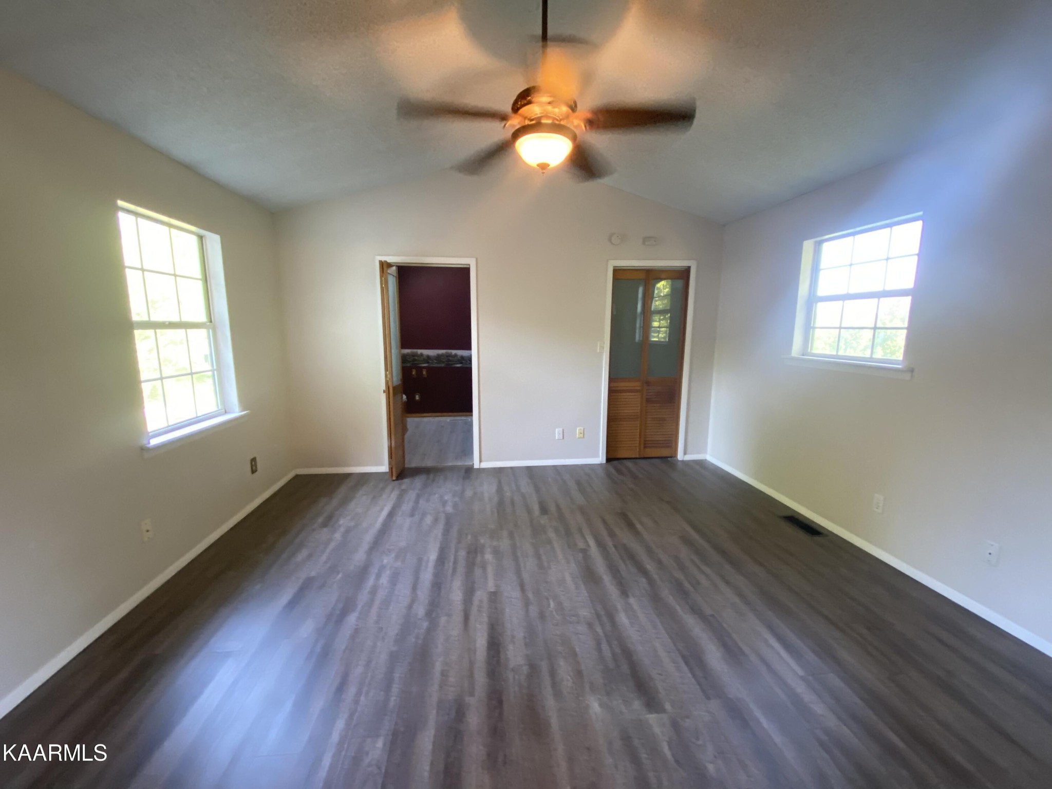 132 Dustin Lane Oneida, TN 37841 - Photo 24 of 27 a view of an empty room with wooden floor and a window