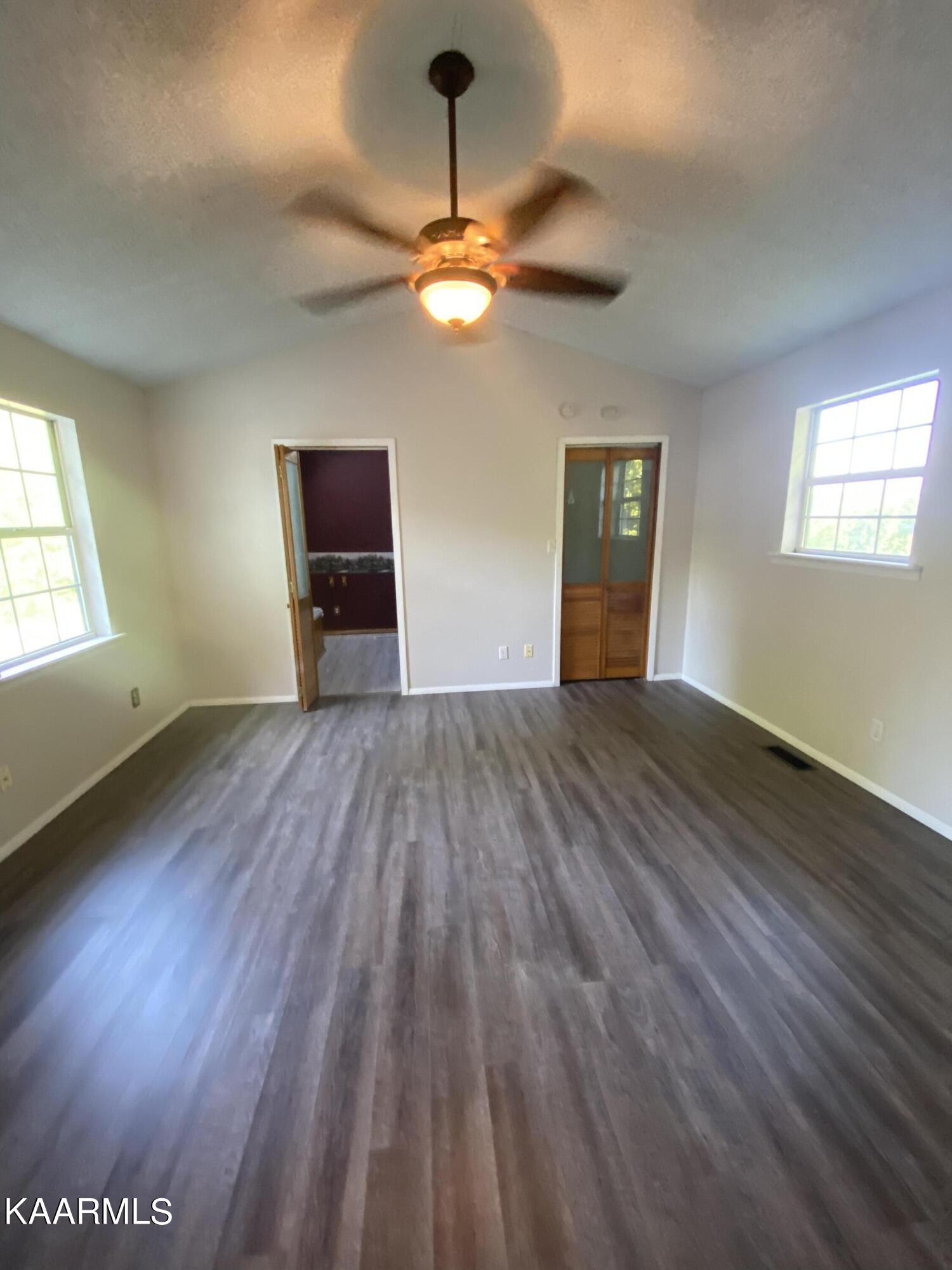 132 Dustin Lane Oneida, TN 37841 - Photo 25 of 27 a view of empty room with wooden floor
