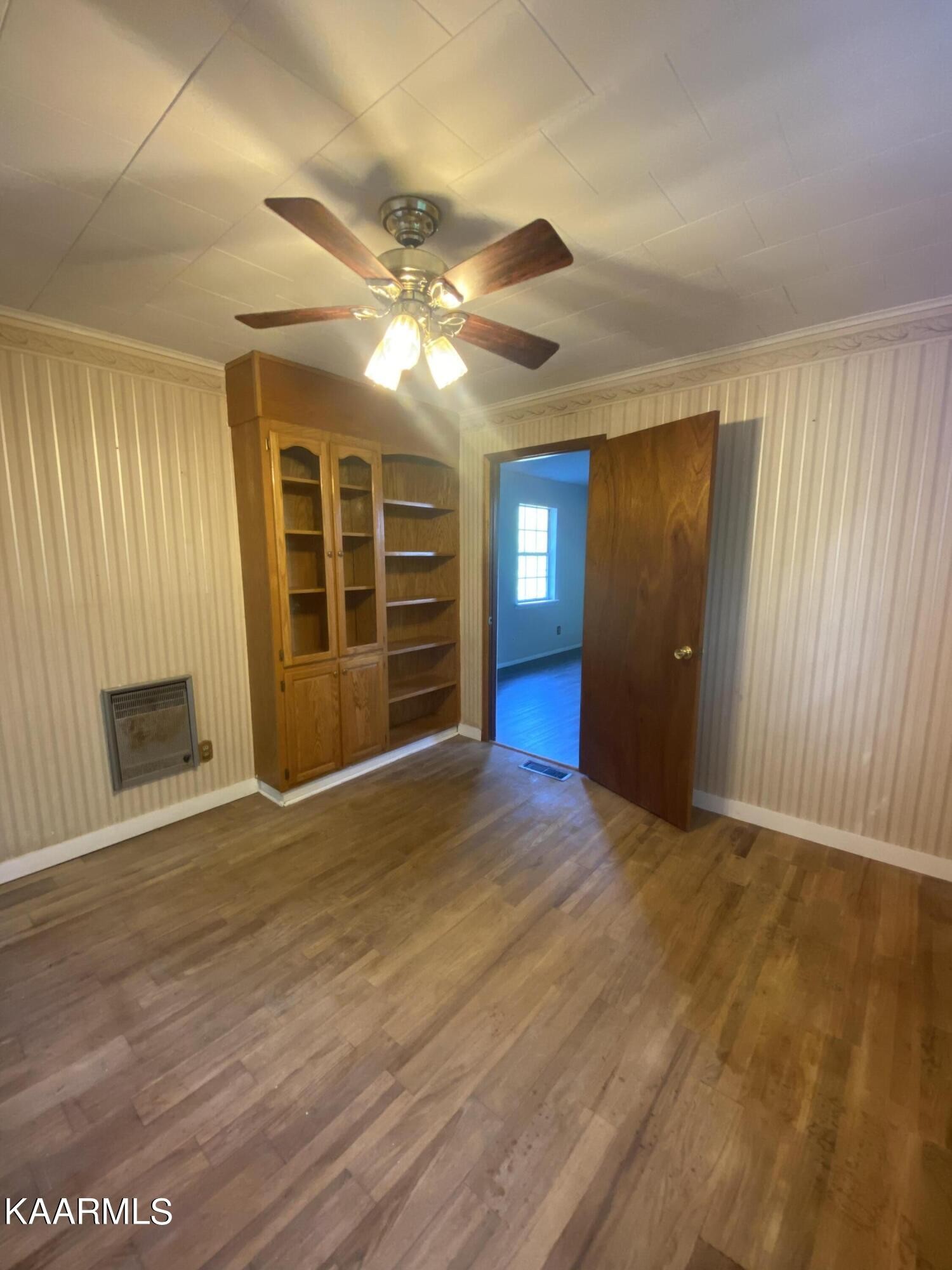 132 Dustin Lane Oneida, TN 37841 - Photo 27 of 27 a view of an empty room with a fireplace and a window