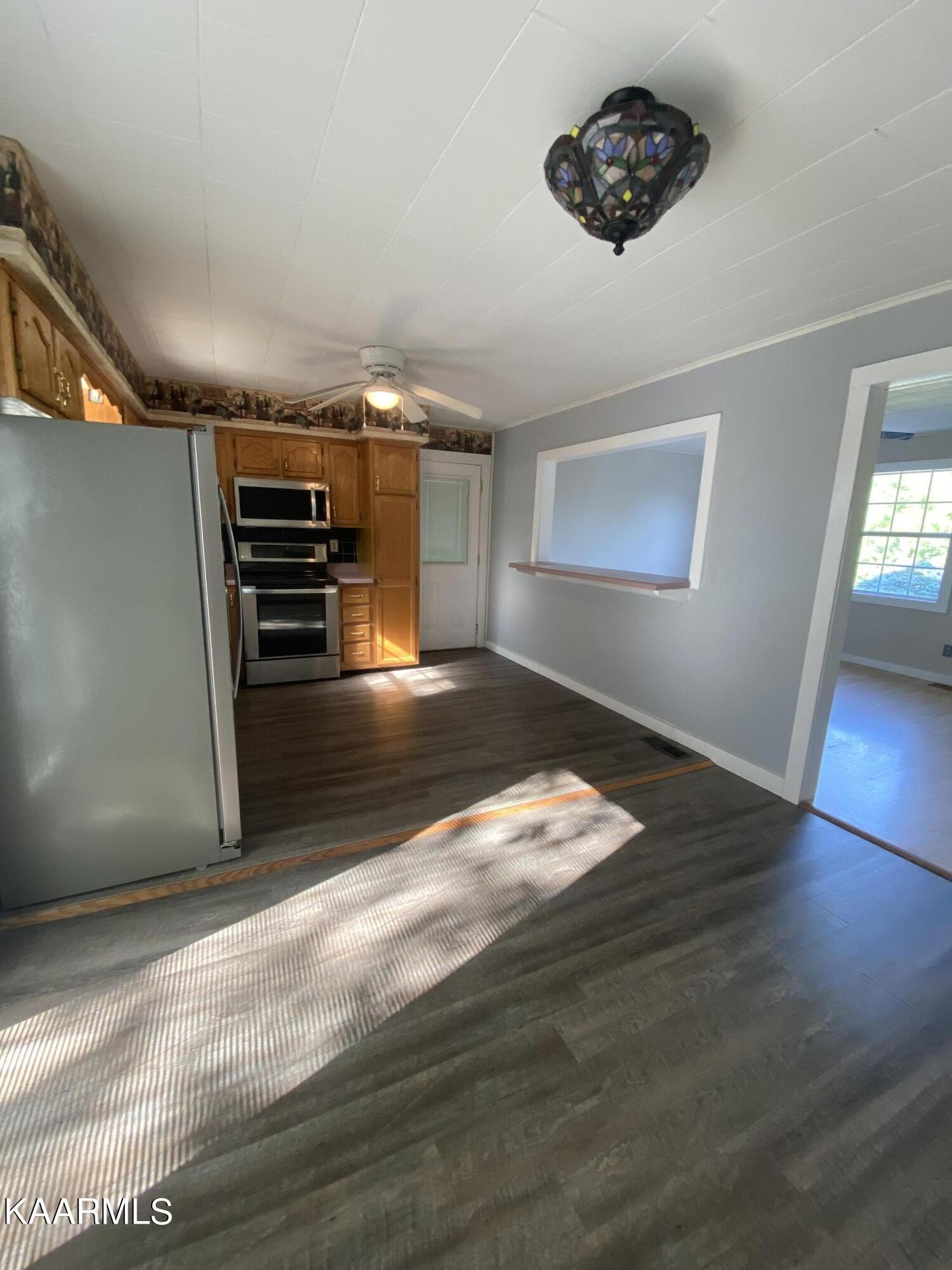 132 Dustin Lane Oneida, TN 37841 - Photo 10 of 27 a view of empty room with wooden floor
