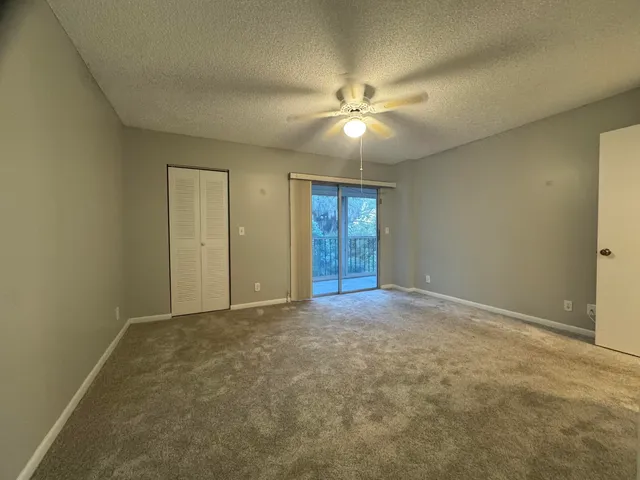 a living room with furniture a chandelier and a chandelier