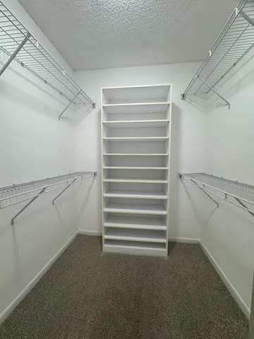 a view of a swimming pool with a yard