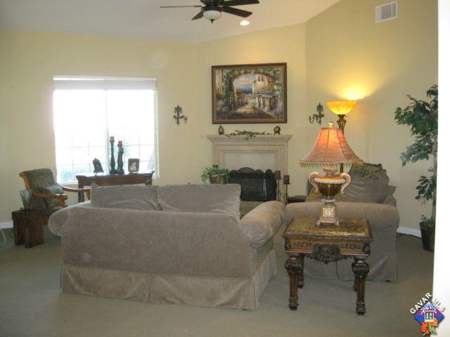 245 Raven Drive Palmdale, CA 93551 - Photo 6 of 10 a living room with furniture and a fireplace