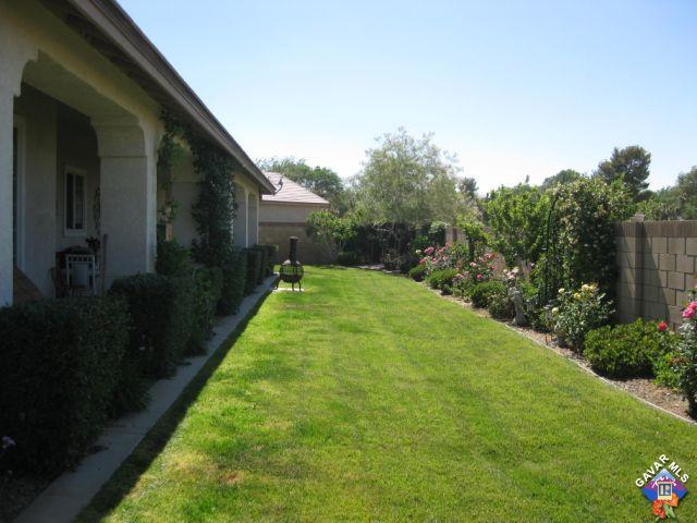 245 Raven Drive Palmdale, CA 93551 - Photo 9 of 10 a view of a backyard with potted plants