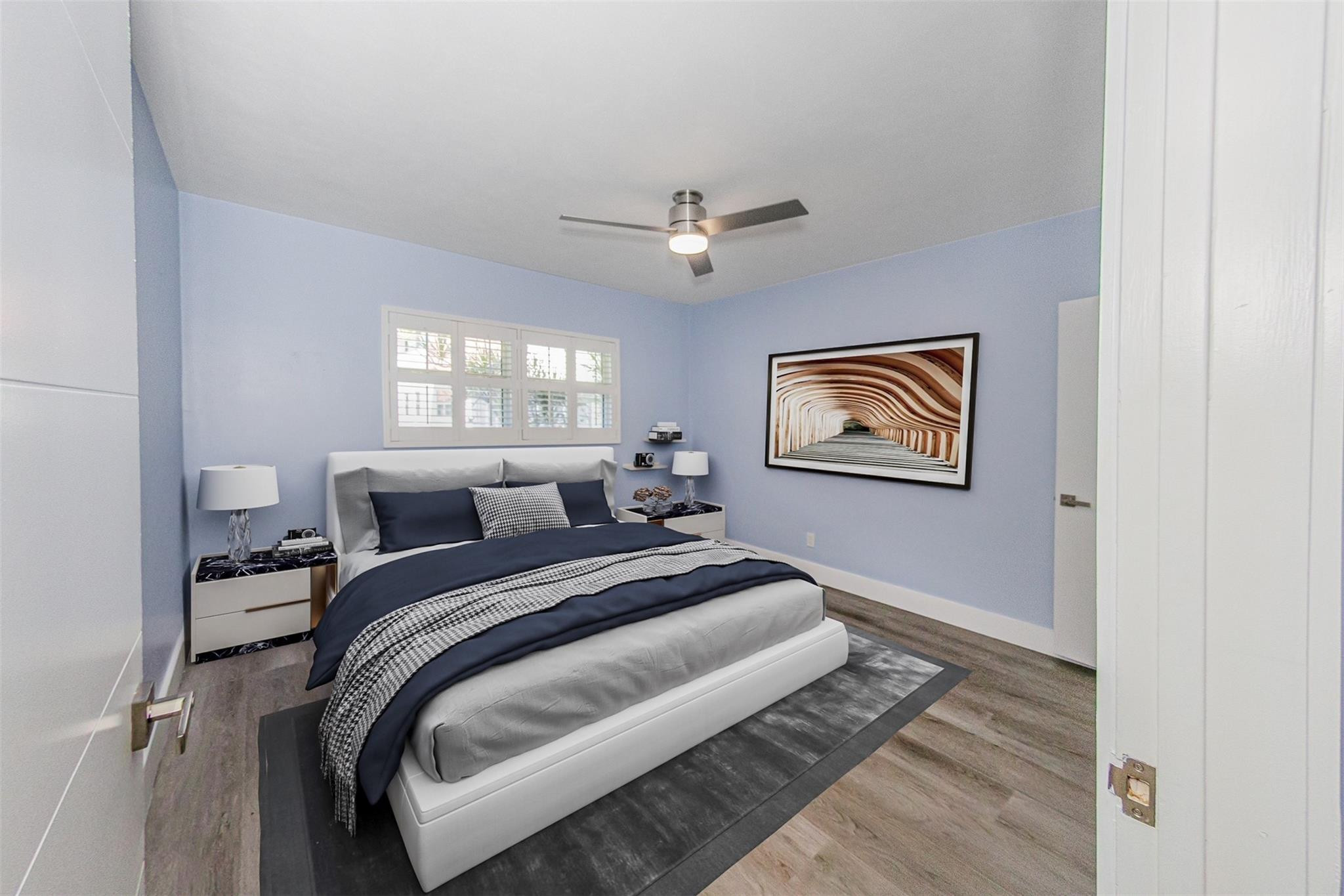 1991 Northeast 32nd Street, Unit 18 Lighthouse Point, FL 33064 - Photo 12 of 39 a bedroom with bed and a window