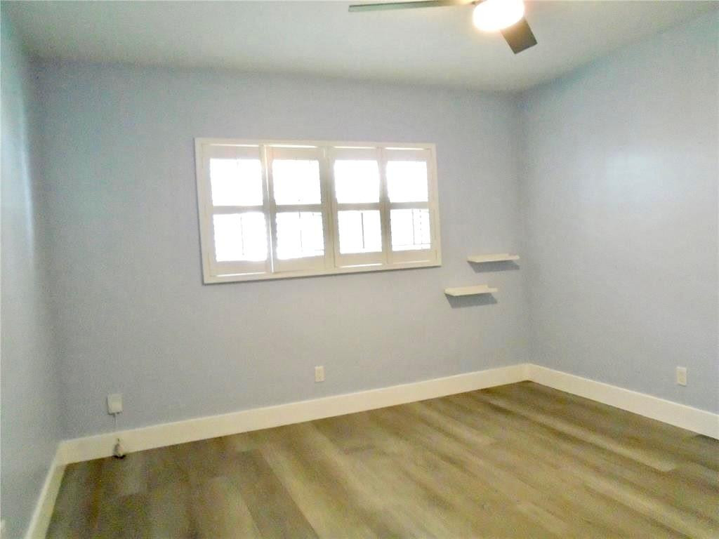 1991 Northeast 32nd Street, Unit 18 Lighthouse Point, FL 33064 - Photo 15 of 39 an empty room with a window