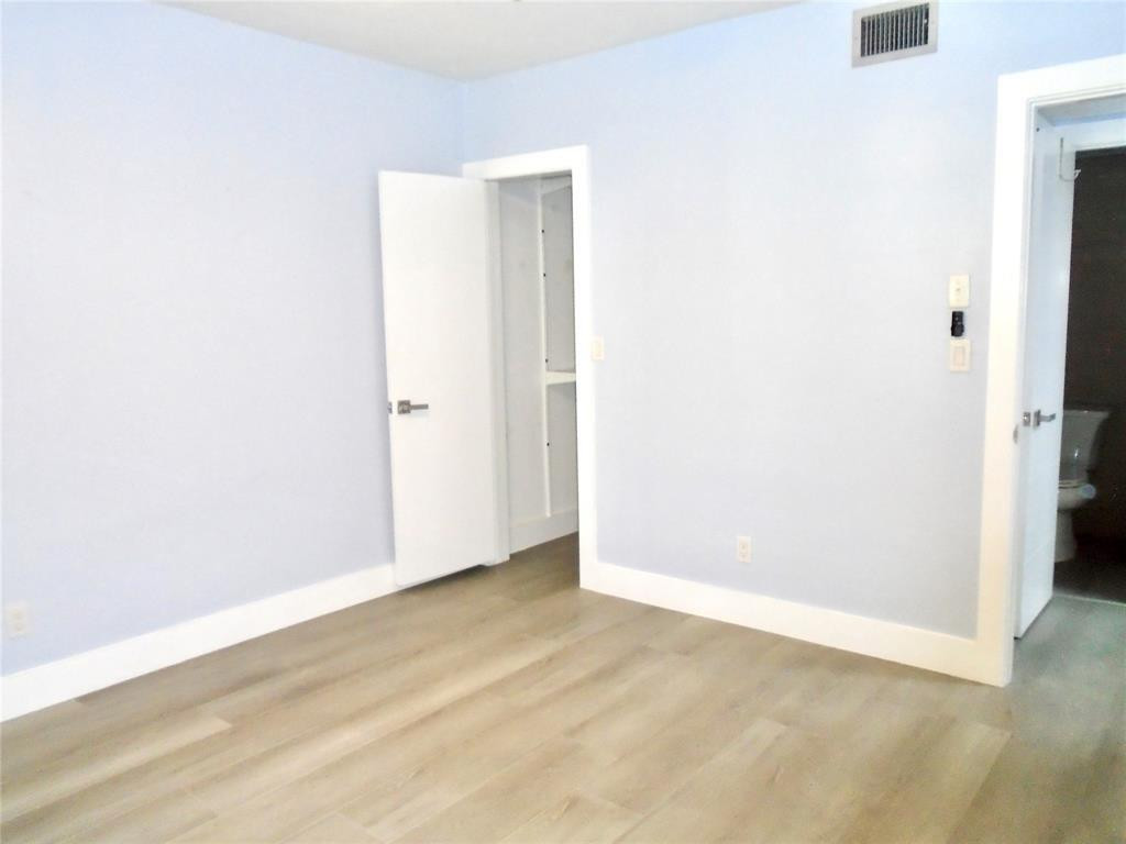 1991 Northeast 32nd Street, Unit 18 Lighthouse Point, FL 33064 - Photo 16 of 39 a view of an empty room
