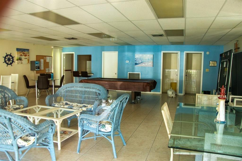 1991 Northeast 32nd Street, Unit 18 Lighthouse Point, FL 33064 - Photo 37 of 39 a view of a dining room with furniture window and outside view