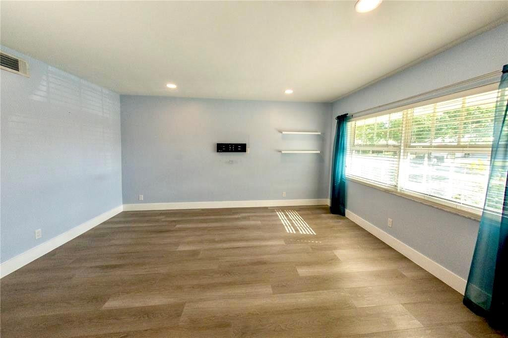 1991 Northeast 32nd Street, Unit 18 Lighthouse Point, FL 33064 - Photo 5 of 39 a view of an empty room with a window